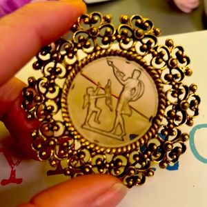 Aeros Greek Cupid love etched brooch